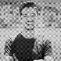 a black and white photo of a man in a t shirt